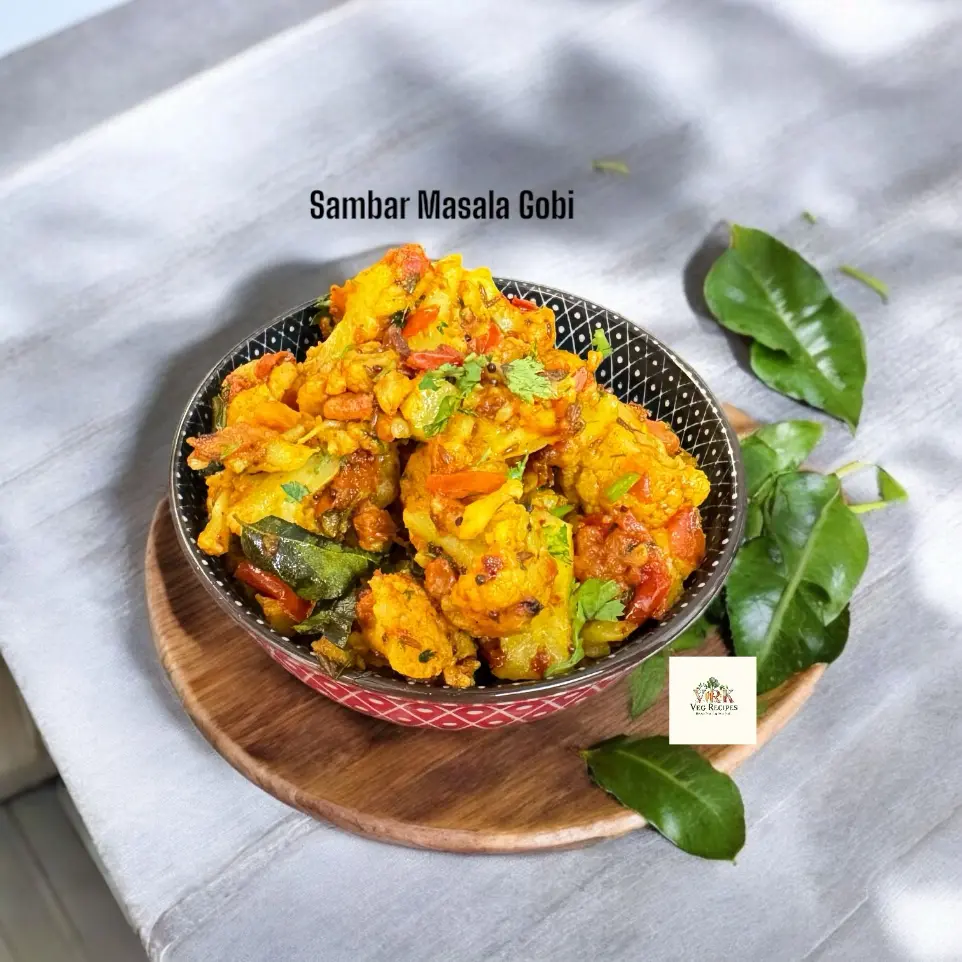 Sambar Masala Gobi | South Indian Cauliflower Curry Sambar Masala Gobi served hot in a bowl, garnished with curry leaves and mustard seeds, perfect as a spicy South Indian side.