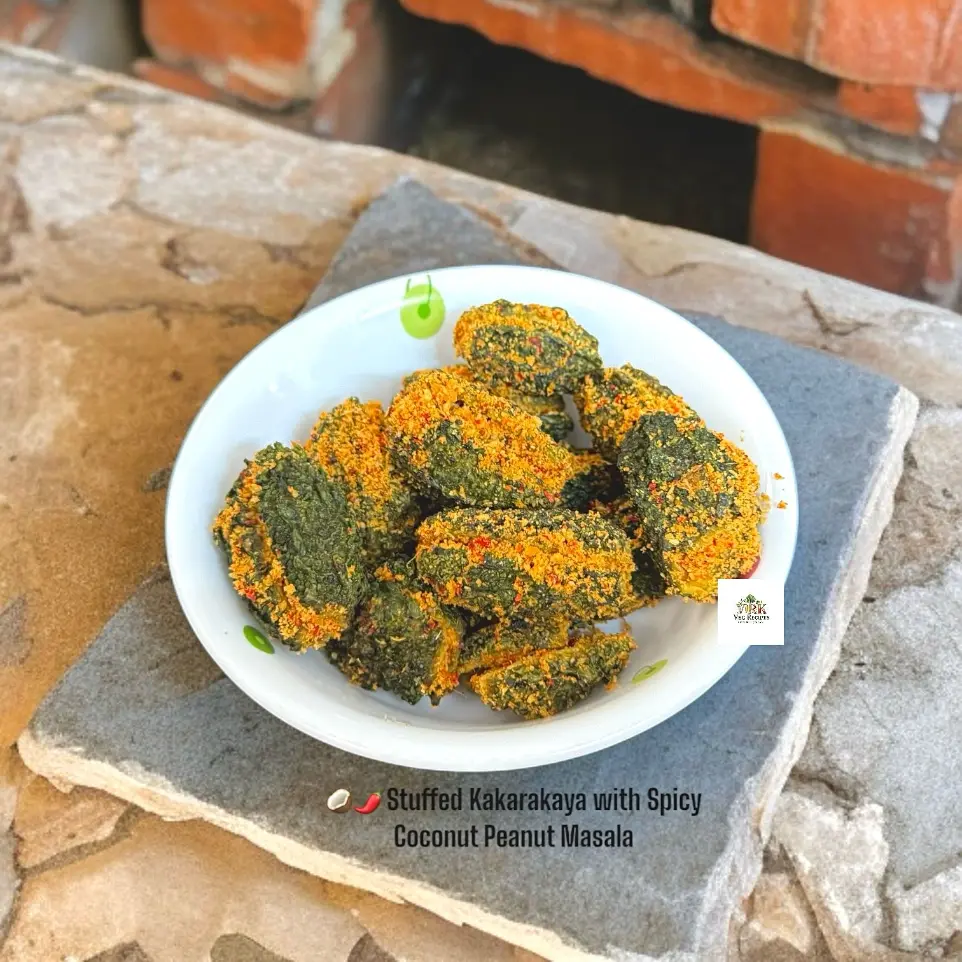 Stuffed Kakarakaya with Spicy Coconut Peanut Masala Recipe Stuffed kakarakaya with spicy coconut peanut masala, showcasing the crispy and flavorful bitter gourd dish, served with a rich tempering.