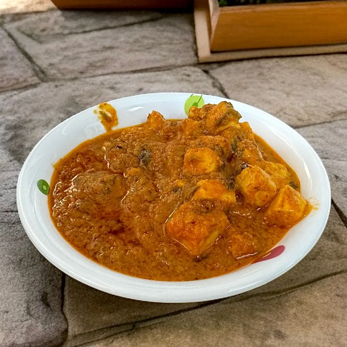 Marinated Paneer in Creamy Spiced Gravy Spicy paneer cubes simmered in rich onion-tomato gravy, garnished with fresh herbs and served hot.