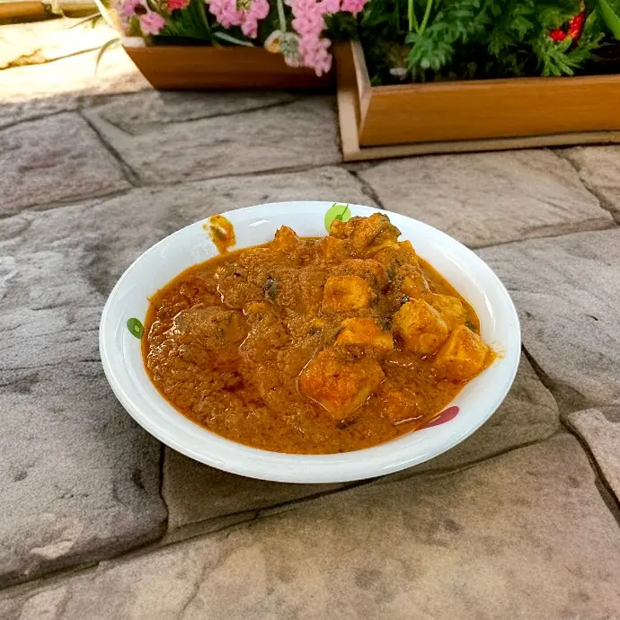 Paneer Curry with Tomato-Onion Masala Marinated paneer cooked in aromatic Indian spices with a creamy, flavorful gravy and fresh coriander.