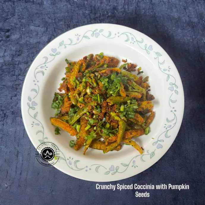 Crunchy fried Coccinia tossed in bold spices with roasted pumpkin seeds, curry leaves, and a touch of tangy amchoor.