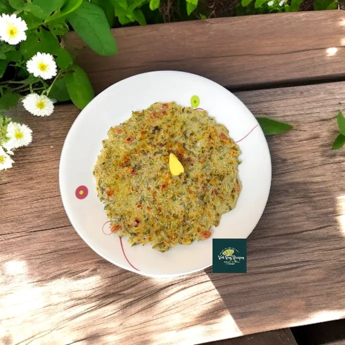 Crisp rice flour flatbread made with lauki, leafy greens, onions and served with spicy chutney and melted butter.