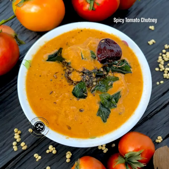 Spicy tomato chutney with sesame, garlic, and red chillies, served fresh with dosa or idli for a fiery flavor burst.