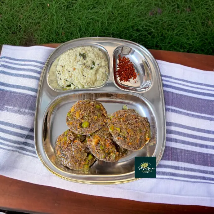 Ghee-tempered ragi idlis packed with cashews, veggies, and spices — a protein-rich, gluten-free breakfast choice.