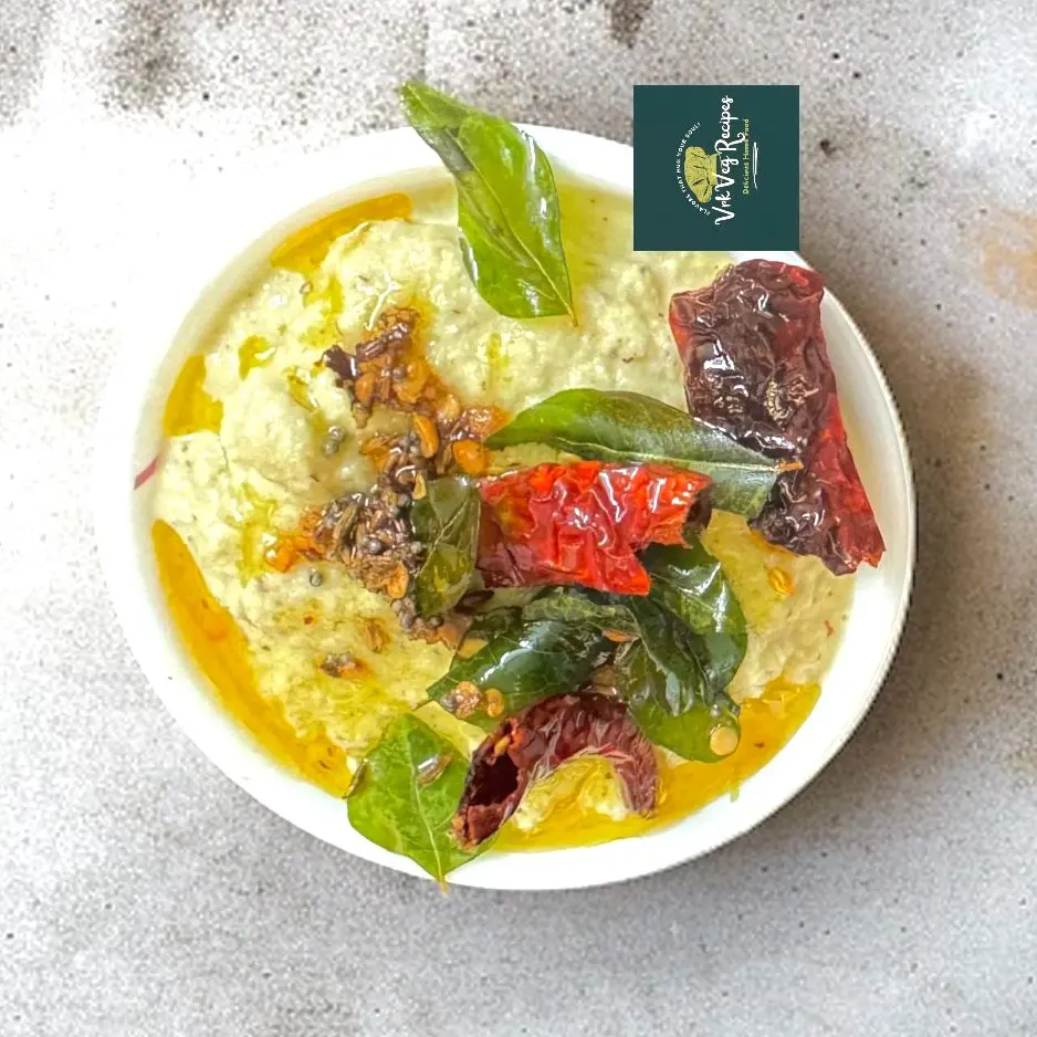 Coconut chutney with roasted channa dal, green chillies, and aromatic South Indian tempering