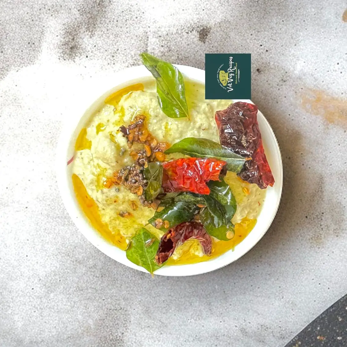 Fresh Coconut Chutney with Tempering Freshly ground coconut chutney served with crispy dosa and spicy red chilli tadka
