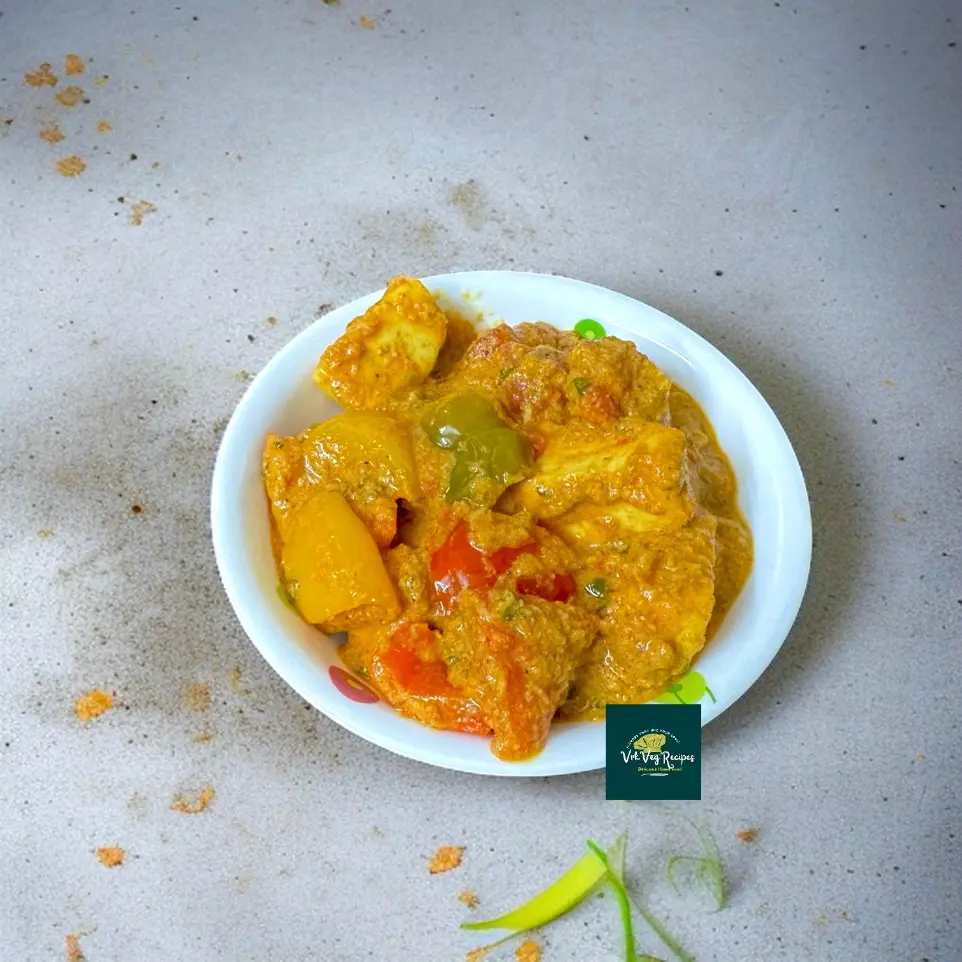 Rich and flavorful curry featuring paneer and tricolor capsicum in a spiced coconut-onion-tomato base.