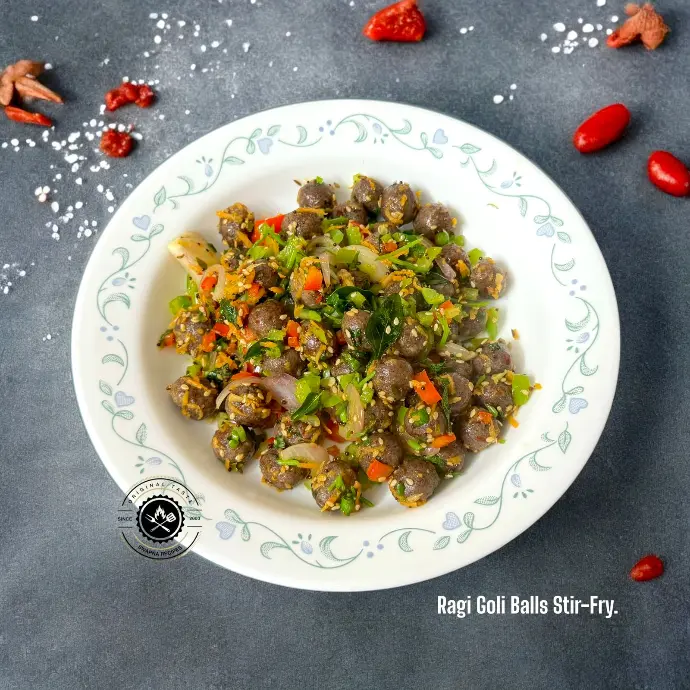 Healthy stir-fry with steamed ragi paneer balls and colorful veggies in South Indian-style tempering