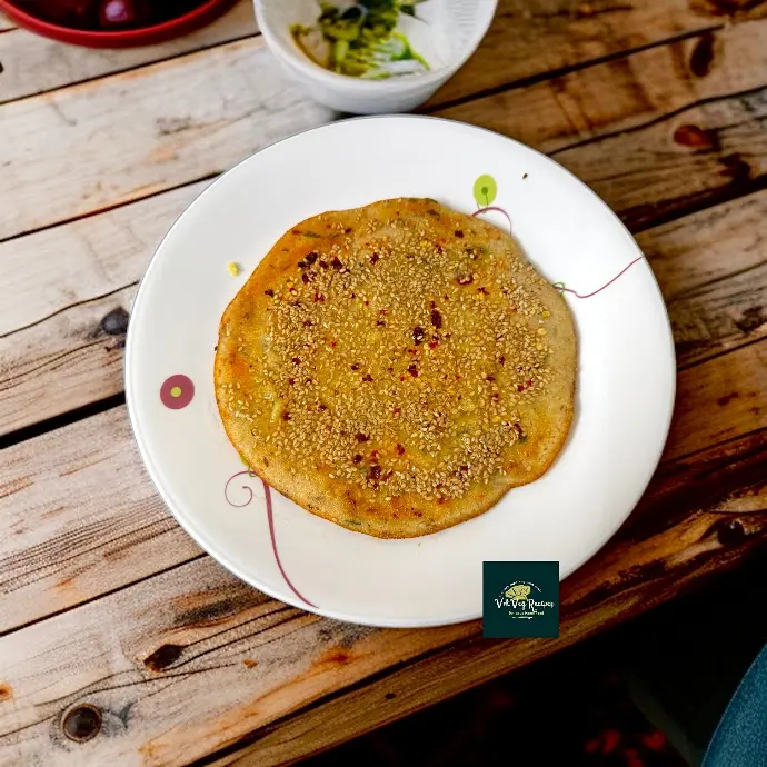 Crisp Jowar Dosa with Desi Flavors & Spices Healthy gluten-free jowar dosa with fiery toppings and aromatic herbs, perfect for breakfast or a light meal.