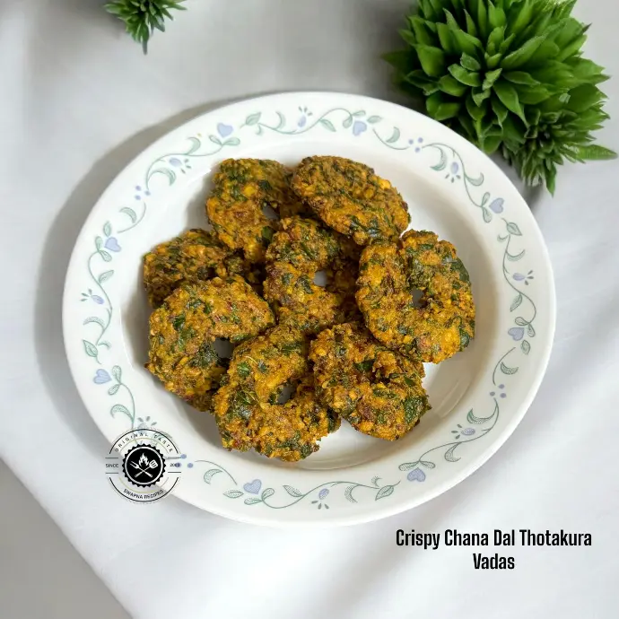 Traditional Thotakura fritters crisped to perfection, combining the earthy flavor of greens with spiced dal batter and crunchy texture.