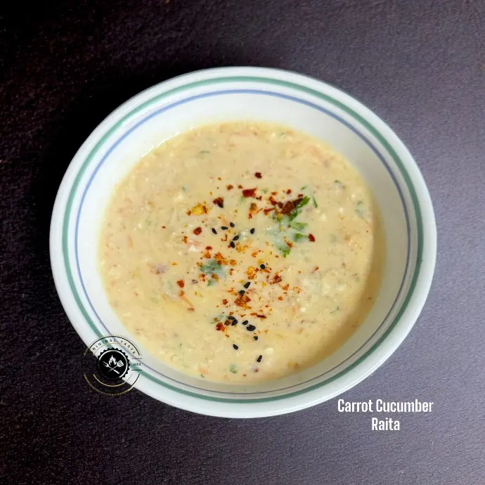 Freshly grated carrot and cucumber mixed in curd with spices for a refreshing Indian raita served chilled with biryani or pulao.