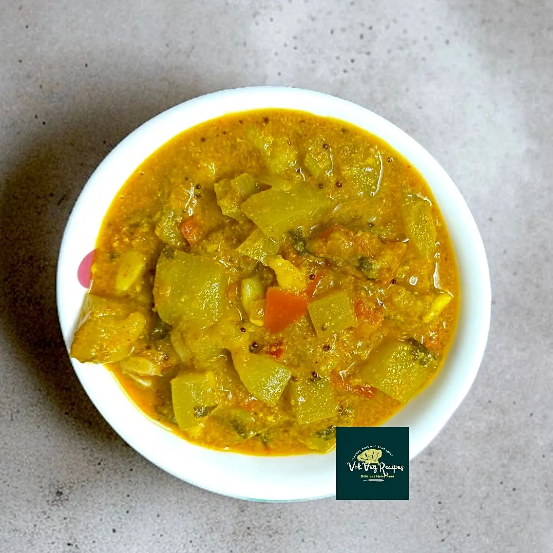 Bottle gourd curry made with nutty masala, sesame, and coconut, garnished with coriander and served hot with rice or roti.