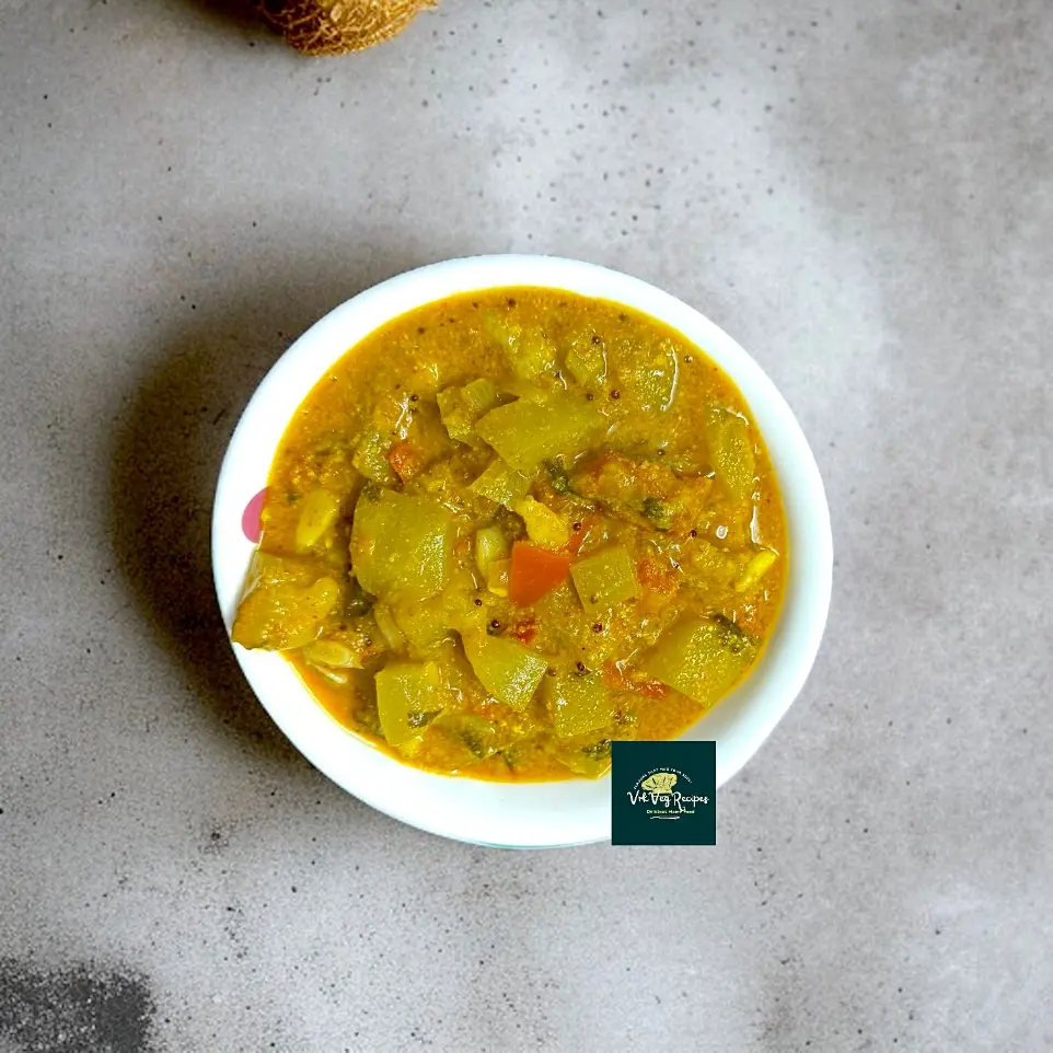 Lauki Curry with Sesame-Coconut Masala Spiced Indian lauki curry featuring a ground masala of seeds and spices, simmered with tomatoes and topped with fresh herbs.