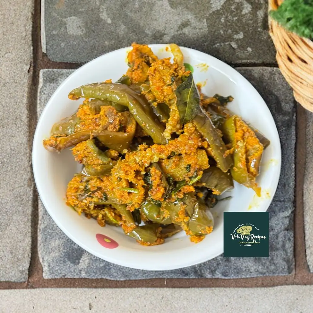 Long Brinjal Fry with Garlic Coconut Masala South Indian-style brinjal fry with spicy coconut masala and garlic seasoning, best enjoyed with steamed rice or warm rotis.