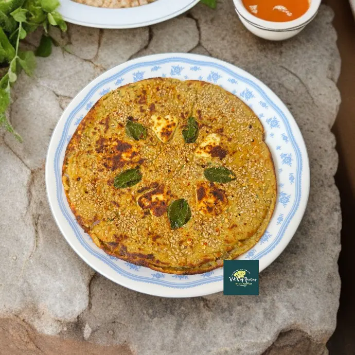 Thick, golden brown chana dal uttapam topped with paneer, sesame, and veggies—roasted on tawa for a no-chutney high-protein snack.