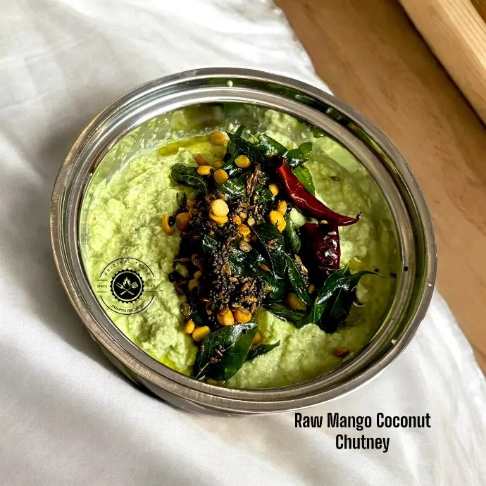 Fresh raw mango coconut chutney with spicy tempering, ideal with dosa, idli, or rice for a tropical twist in traditional South Indian meals.