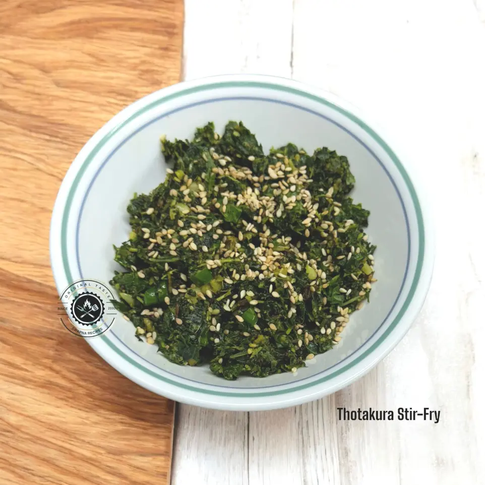 Thotakura stir-fry with sesame, garlic, and chillies served hot as a side dish with rice or roti for a healthy South Indian vegetarian meal.
