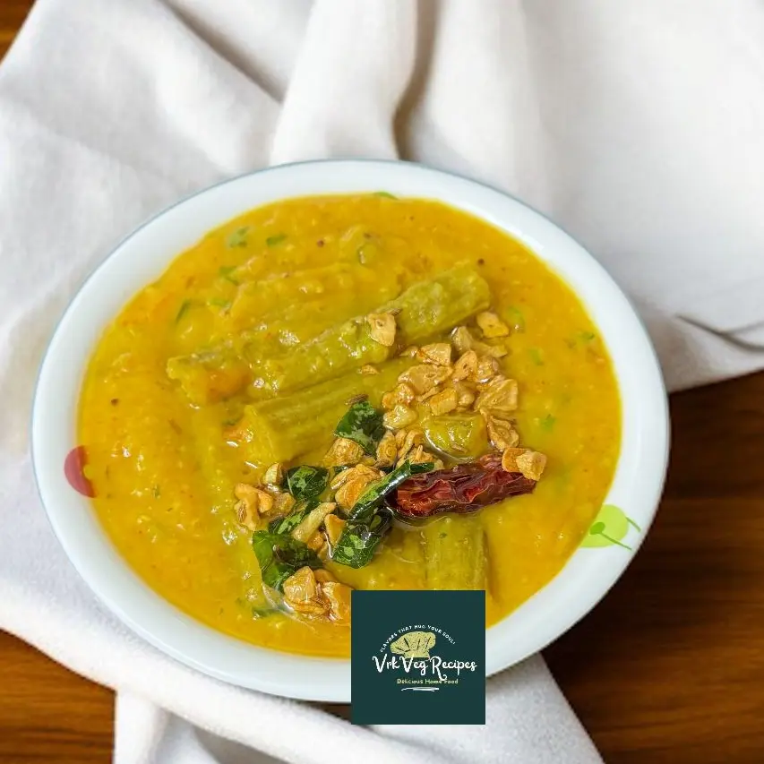 Drumstick dal with garlic tadka served hot with rice, showcasing flavorful South Indian comfort in one hearty dish.