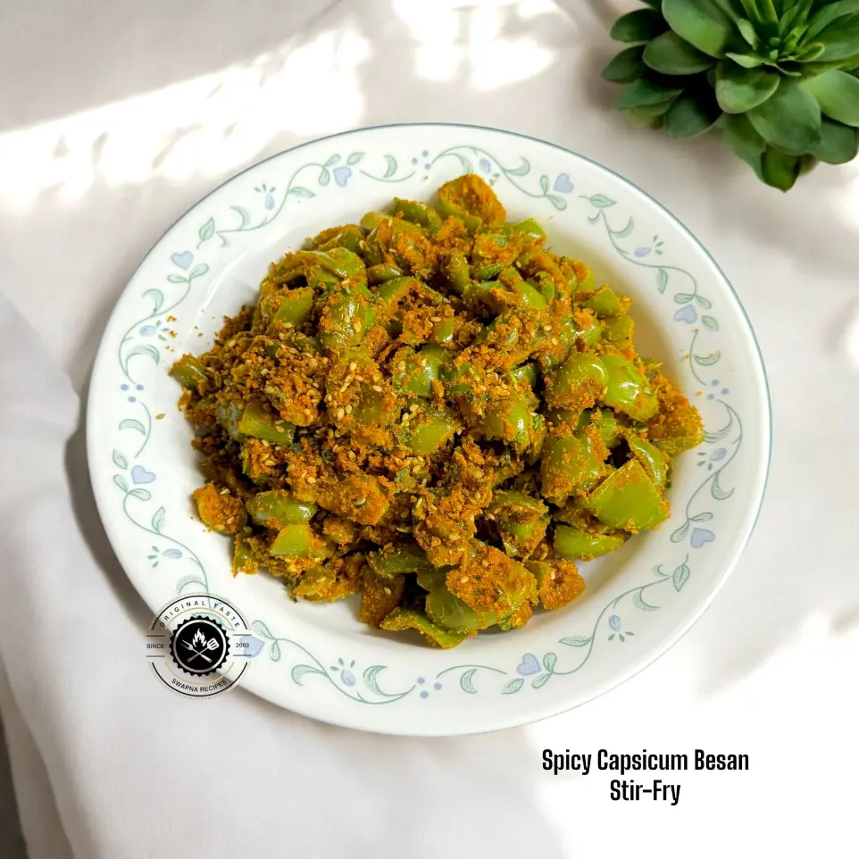 Healthy Capsicum Besan Sabzi Recipe Green capsicum cooked with roasted gram flour, amchur, and spices – an easy and spicy Indian stir-fry recipe.