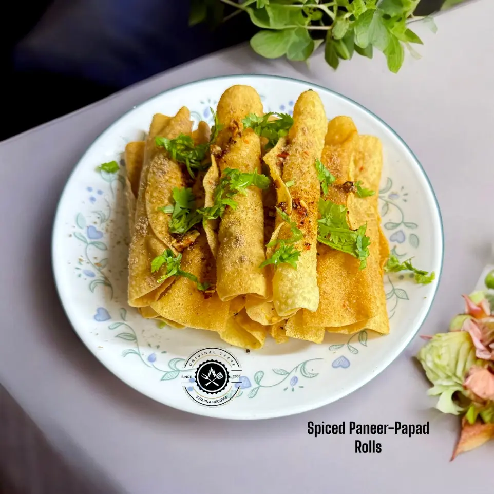 Delicious paneer-stuffed papad rolls served hot with a tangy sprinkle of amchur and chaat masala – an irresistible crispy appetizer.